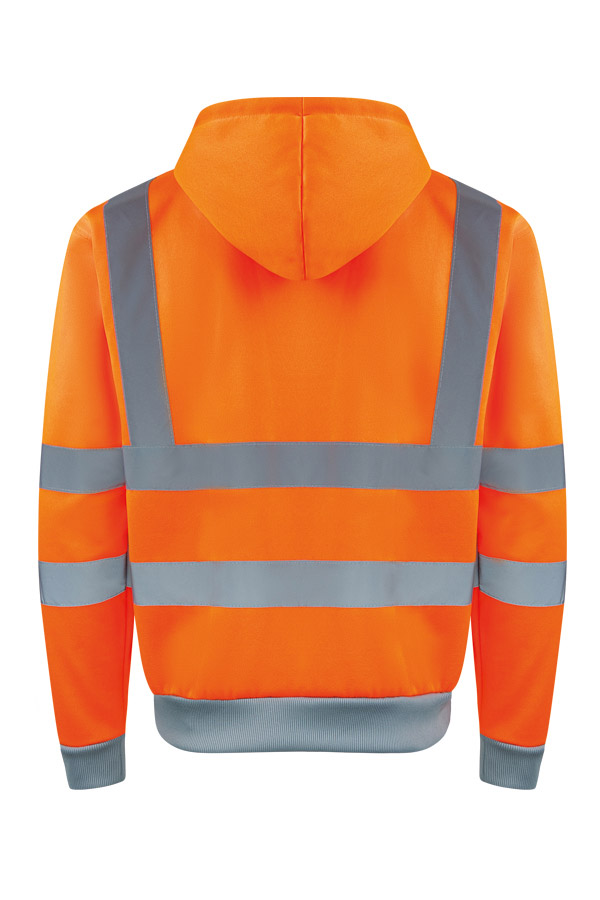 Erwachsener in signalgelbem Korntex-Hoodie mit Zipper und Reflexstreifen in einem industriellen Umfeld